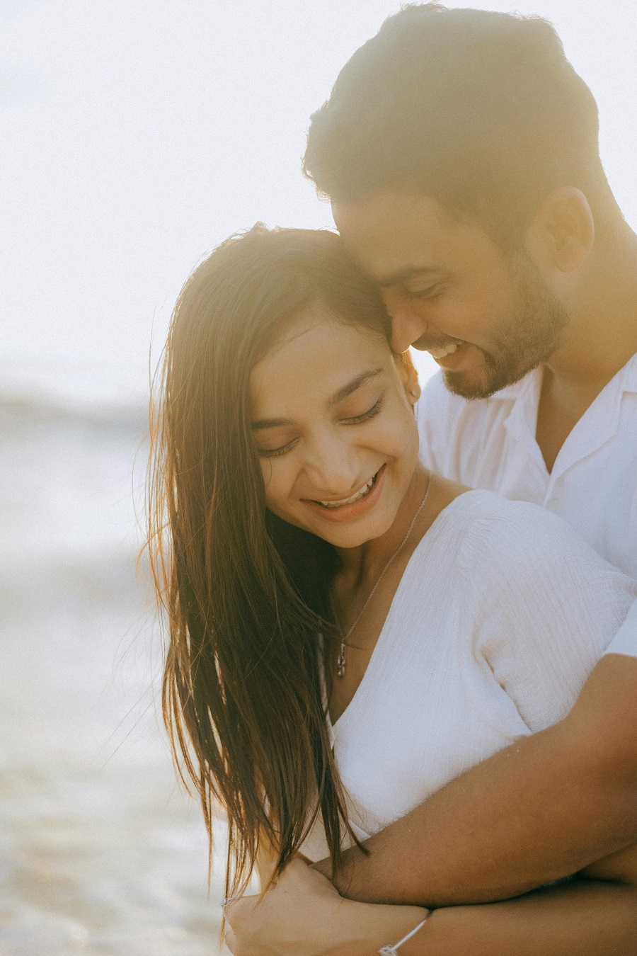 image of couples on a beach